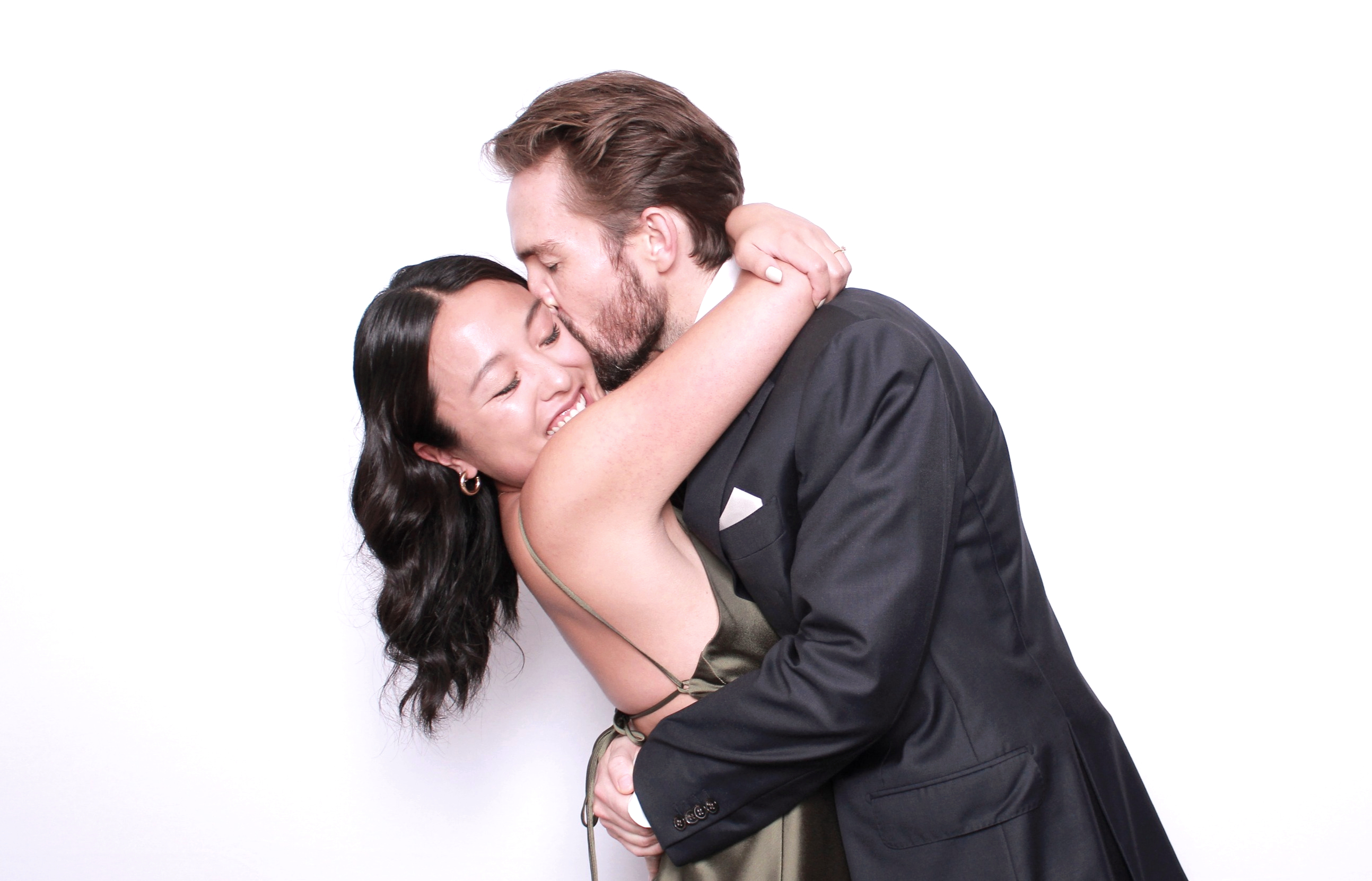 Guests reacting to their Snaptrend glam booth photo at a wedding reception